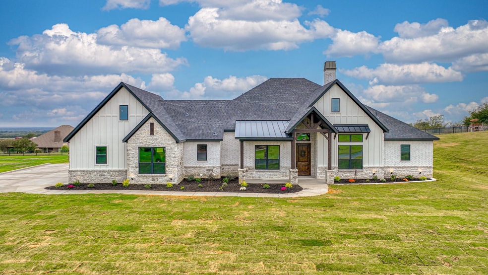 Brilliant Custom Designed Beauty sitting on a gorgeous elevated lot overlooking the gorgeous Canyon West Golf Club Community!