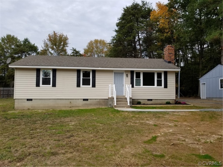 Welcome Home! Beautiful new siding and windows! New porch railings and sidewalk!