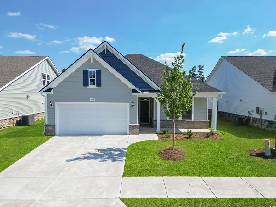 Craftsman house featuring central AC and a front lawn