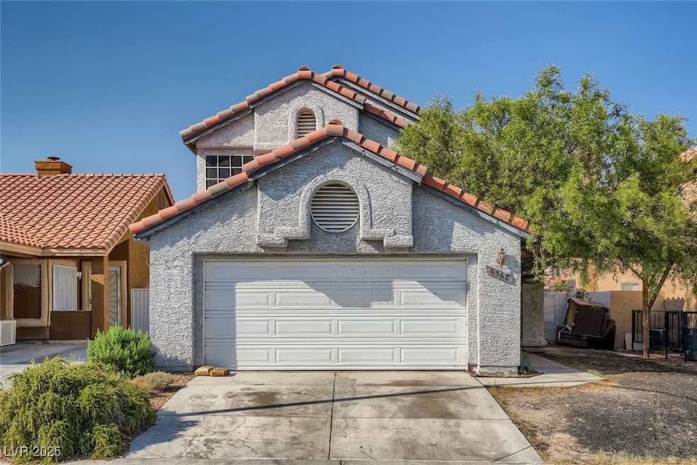 View of front of house with a tiled roof, concrete