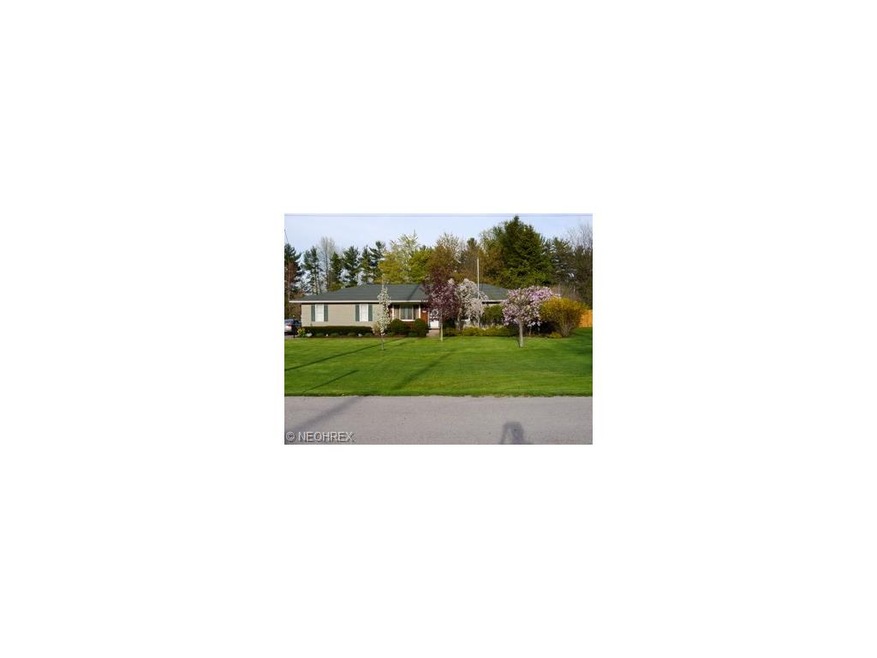 Beautifully landscaped front yard enhances the cur