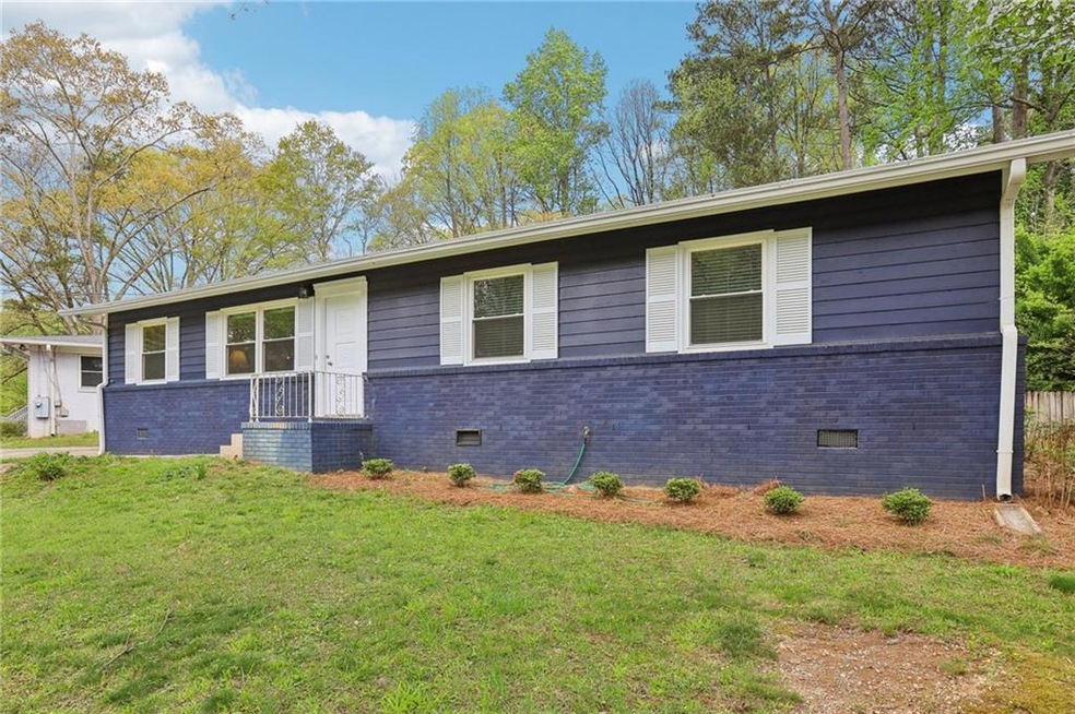 Ranch-style home with brick siding, crawl space, a