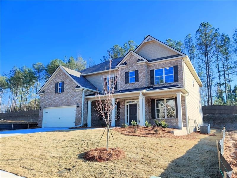 This beautiful Oakmonte plan includes brick front 