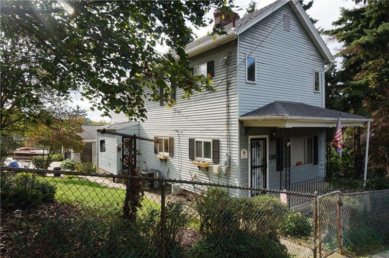 Fenced yard with patio and off street parking in b