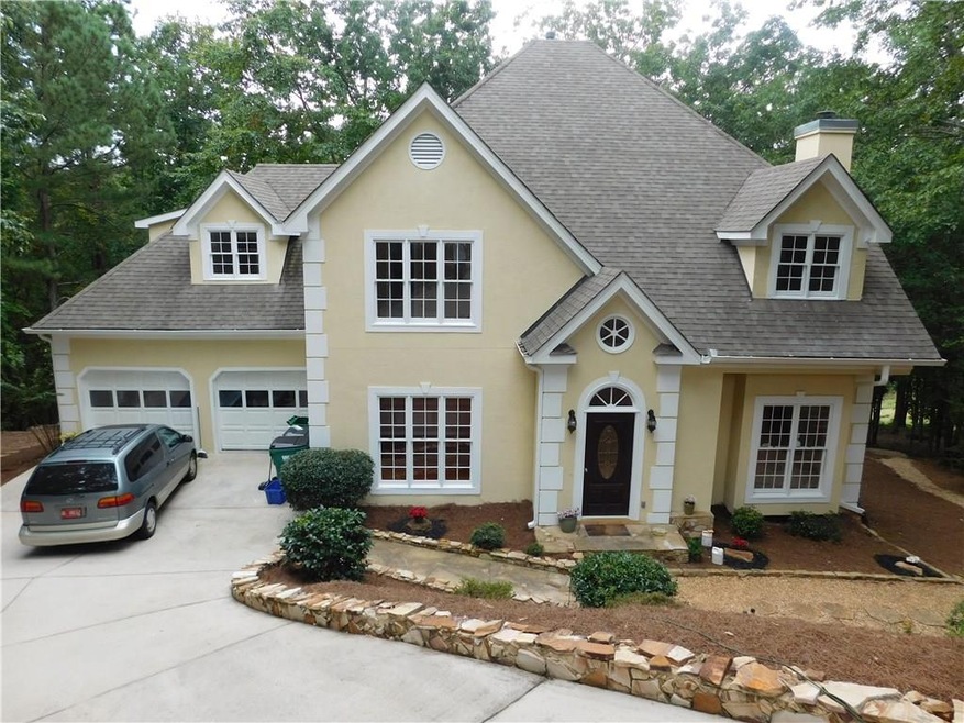 Front Faade Hard Coat Stucco and lots of stone acc