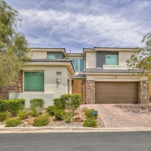 FRONT FEATURING LOW MAINTENANCE LANDSCAPE
