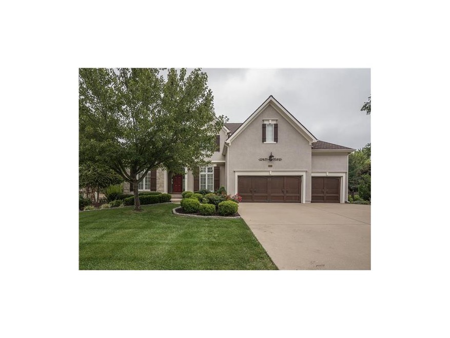 Front elevation with custom garage doors
