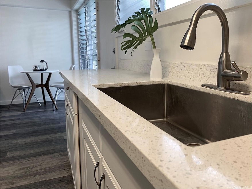 Kitchen sink toward dining