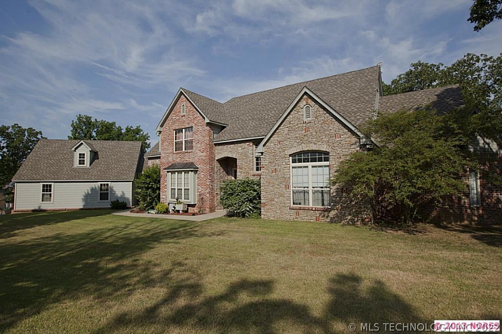 Custom home nestled on 5 wooded acres in East Brok
