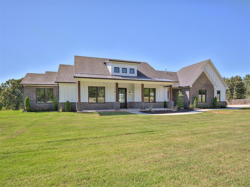 View of front of property featuring a shingled roo