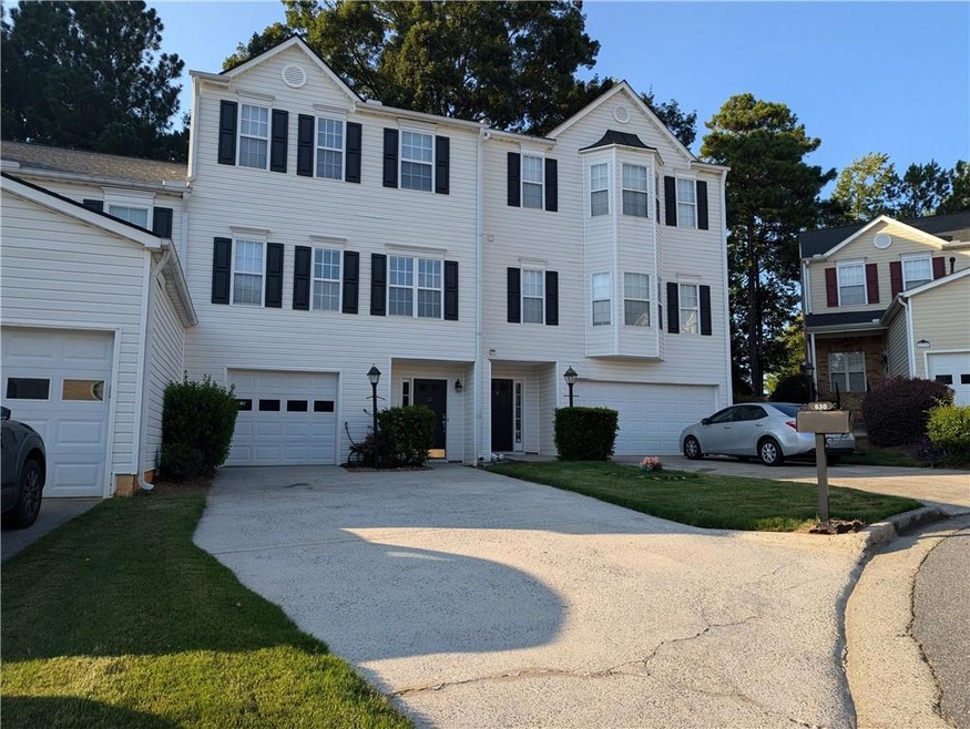 View of front of home featuring a garage and a fro