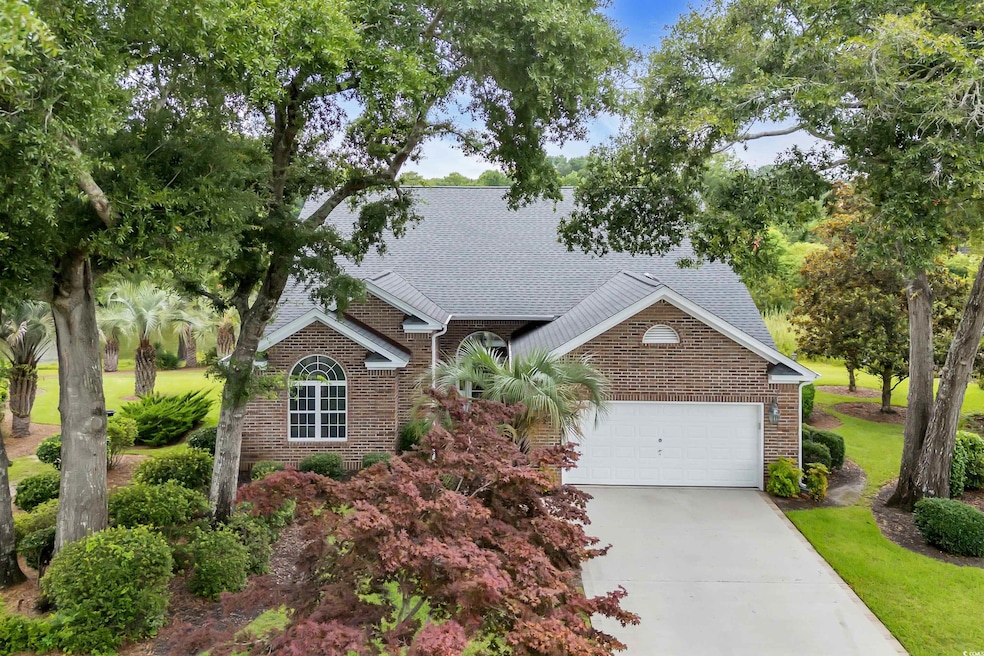 View of front of home with brick siding, a shingled roof, and an attached garage