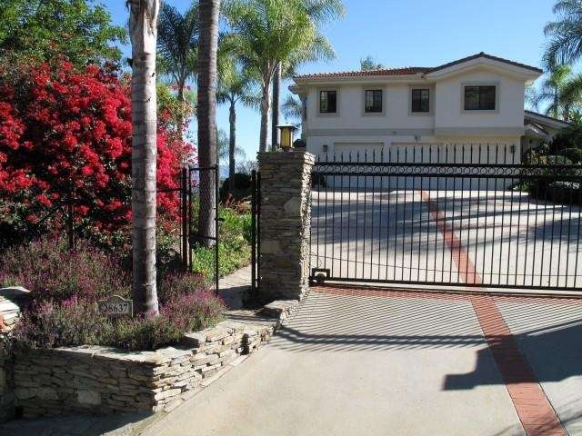 Front entrance that shows large driveway, 3-car ga