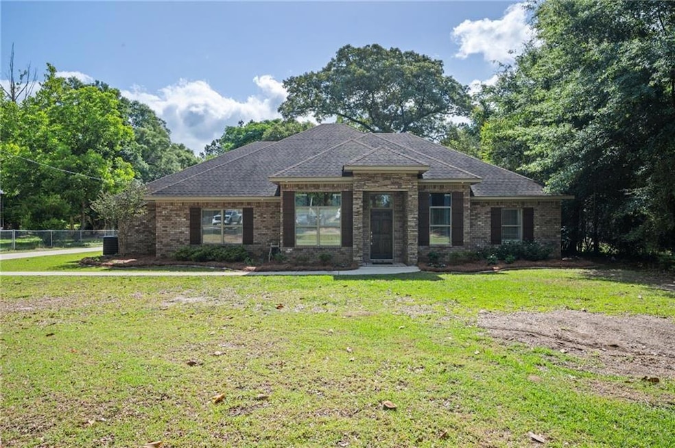 View of front of property with brick siding and ro