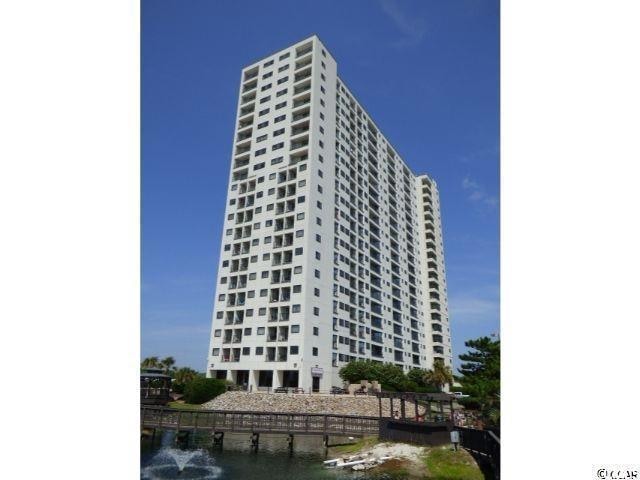 View of building exterior featuring a water view