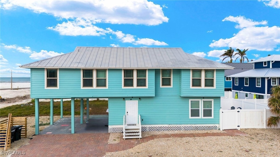 View of front of house featuring a carport and a w