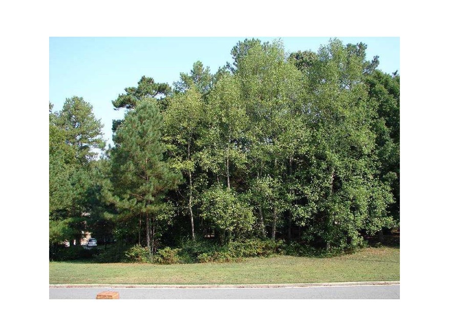Exterior Front. Great wooded lot with lake views.