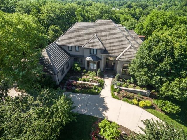 Exceptional 1.5 Story home with 4 car garage and f