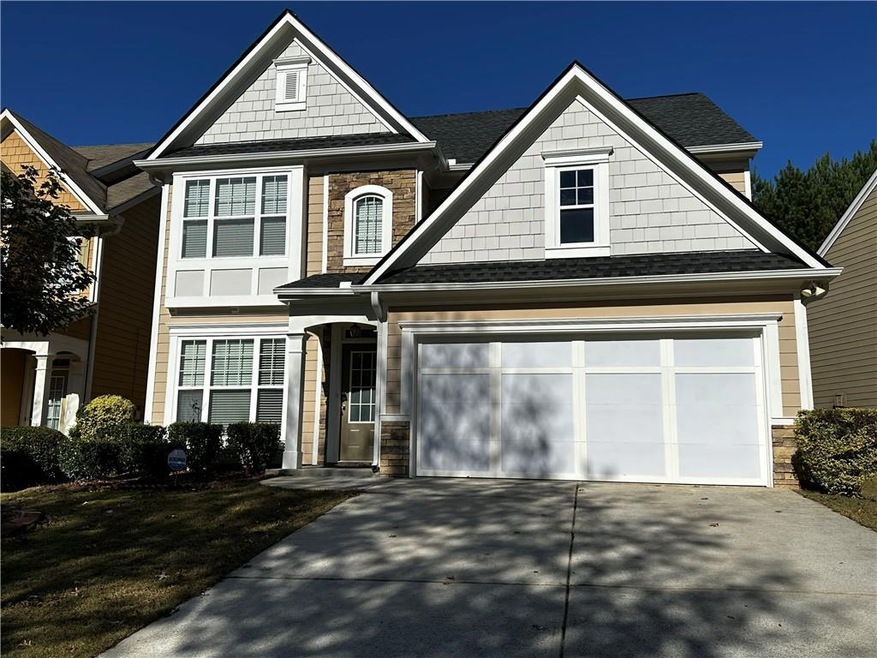 Craftsman-style home featuring a garage