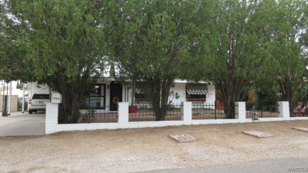 View of property hidden behind natural elements