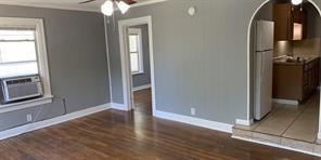 Unfurnished room featuring ceiling fan, cooling un