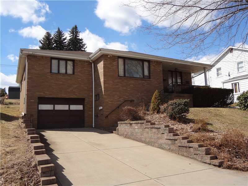 Exterior Front. Welcoming concrete driveway leads 