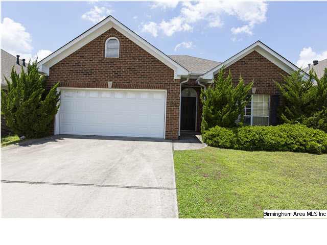 Front View. All brick with garage