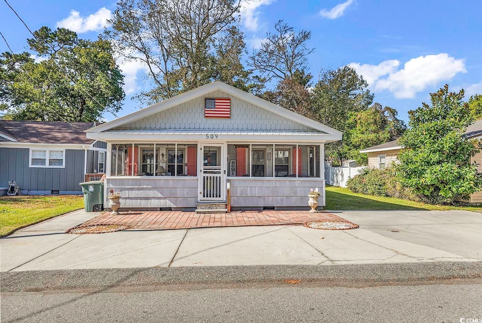 View of front facade with a front yard and a porch
