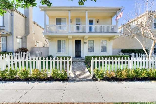 Welcomed by a white picket fence, beautiful flower