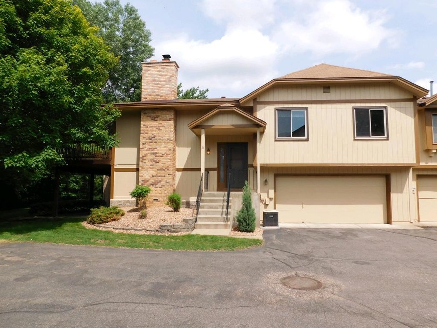 Nicely landscaped, covered entry offers shelter fr