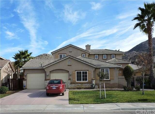 FORMER MODEL HOME!  Landscaped front and back yard
