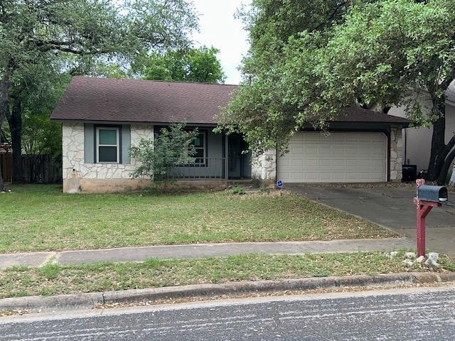 Ranch-style home featuring covered porch, aphalt 