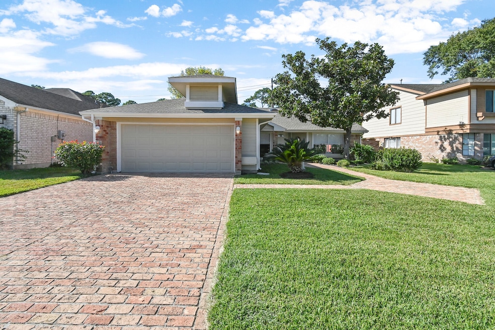 Brick driveway and walkway through the tasteful la