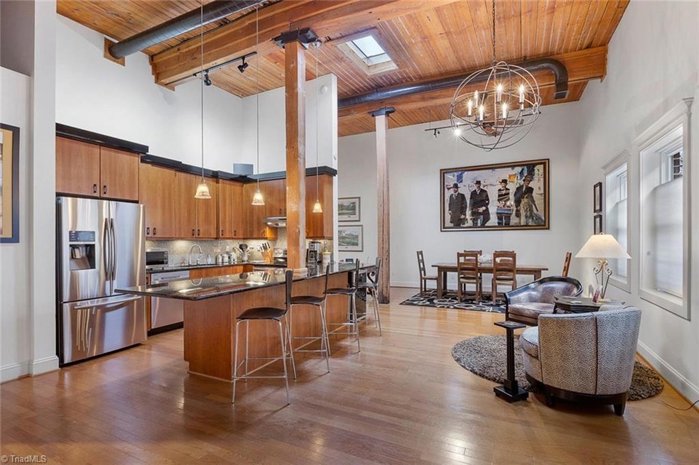 Overview of kitchen, dining and sitting areas.