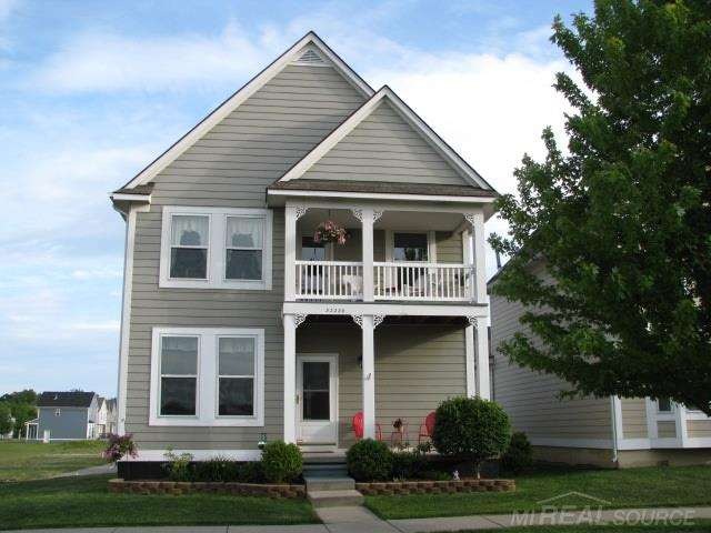 charming colonial with porch and balcony.