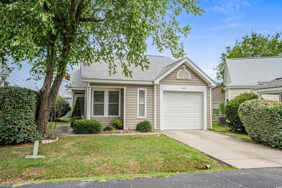 View of front of home featuring a garage and a fro
