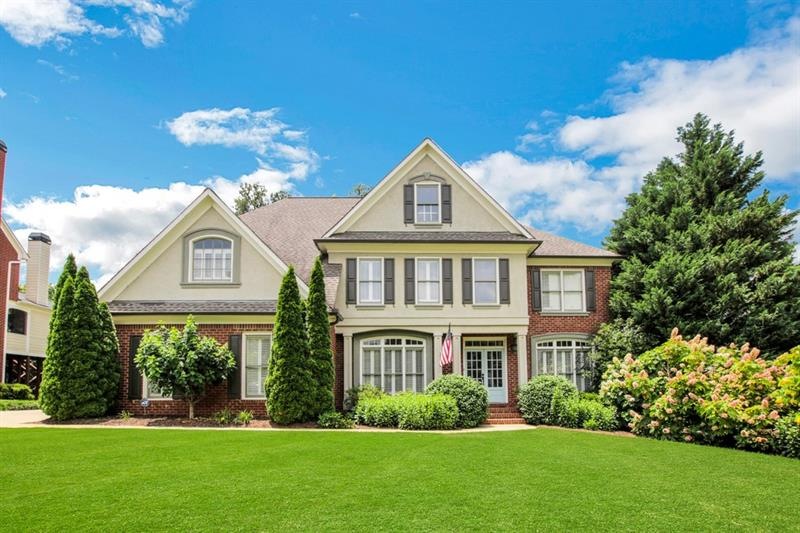 Double front doors and inviting from porch welcome