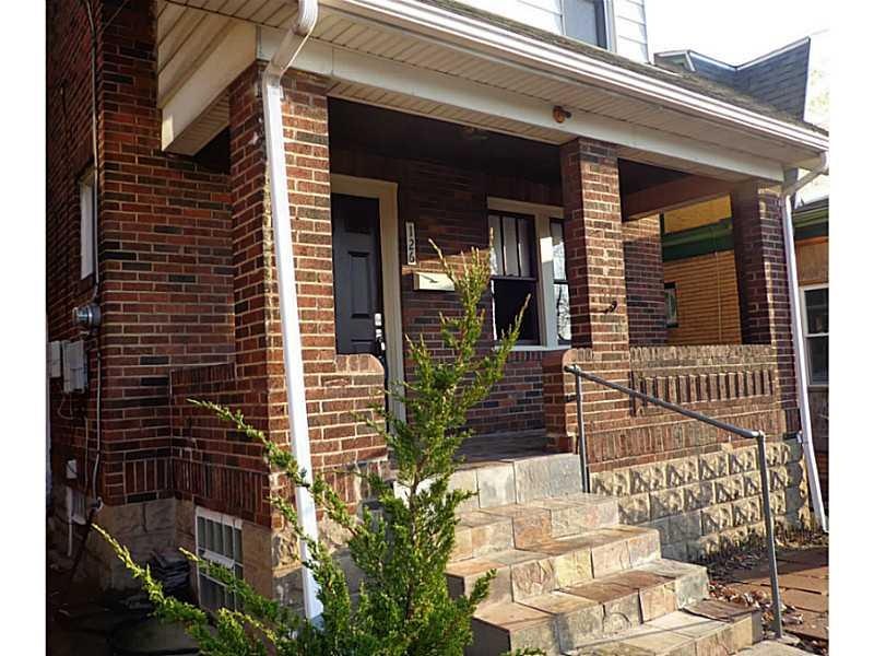 Exterior Front. The house is flanked by beautiful 