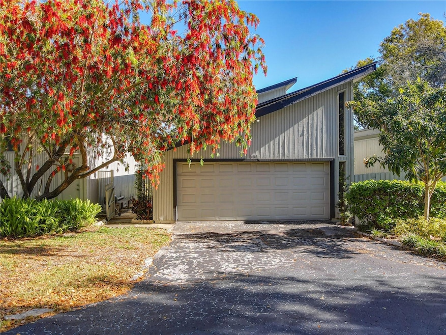 Exterior front, courtyard entrance to left of garage