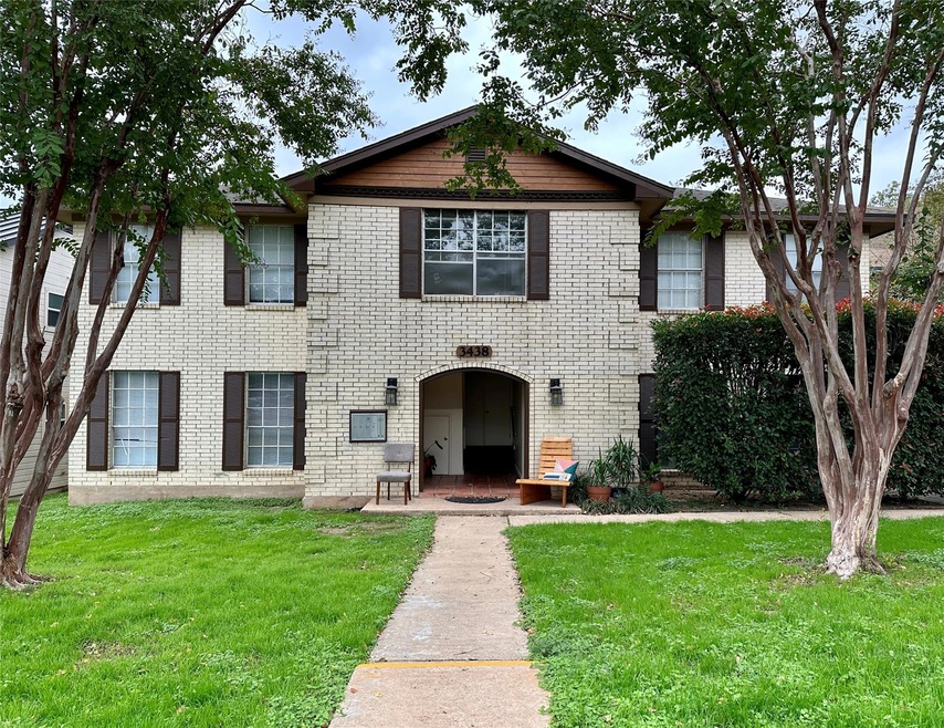 View of front of property with a front yard and b