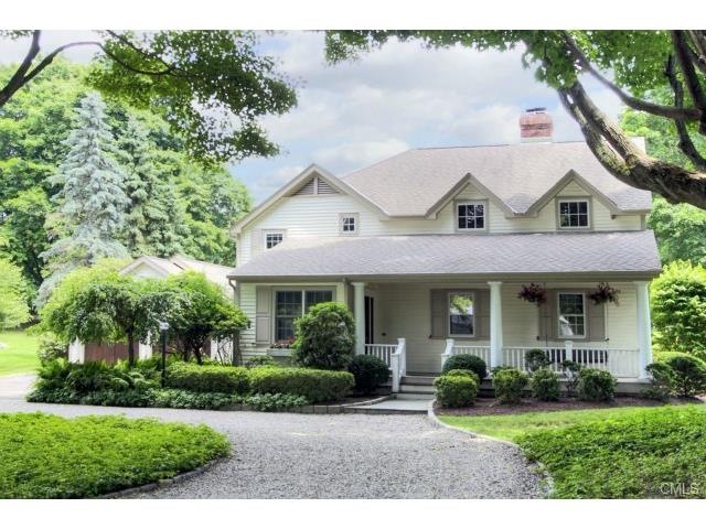 Charming Farmhouse style Colonial has circular gra