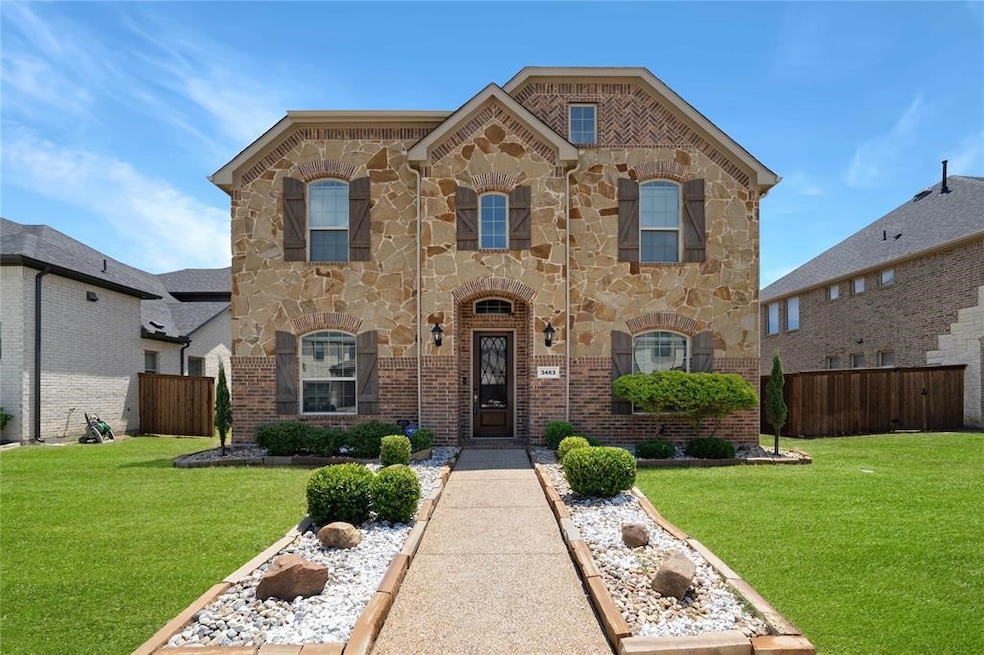 Traditional home with stone siding and brick siding