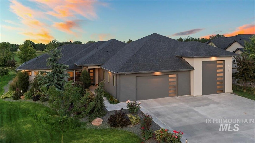 Contemporary home featuring an attached garage and concrete driveway
