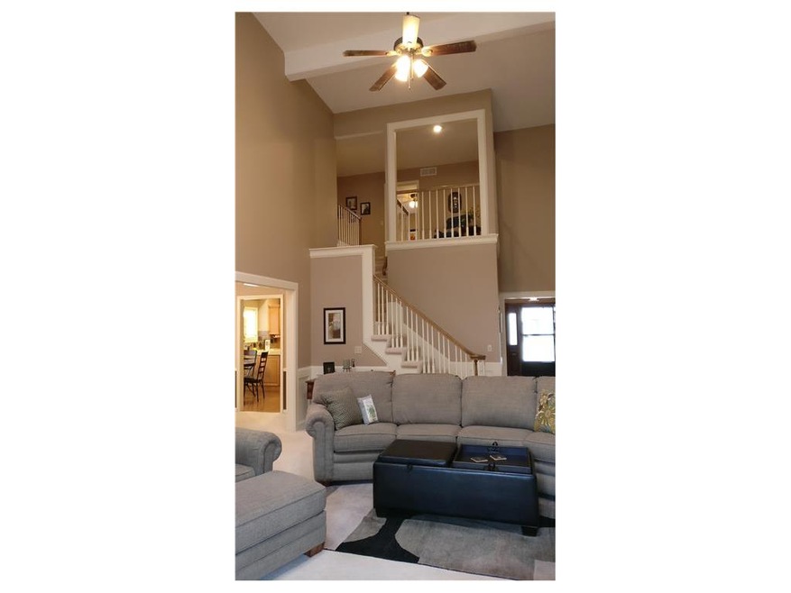 Great room with open staircase to second floor fea