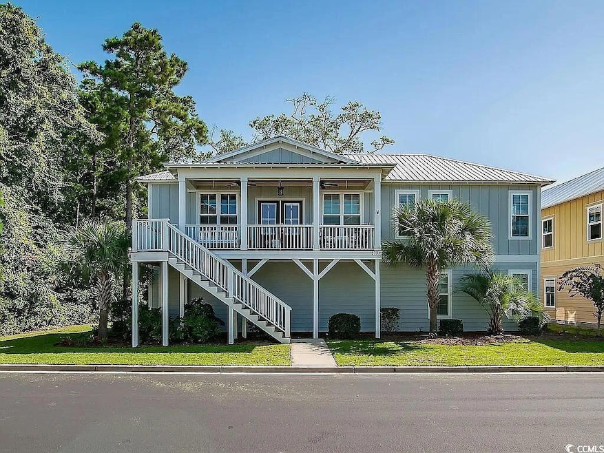 View of front of home featuring stairway, a front 