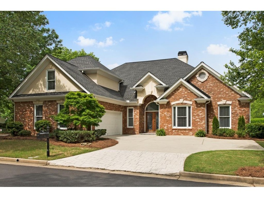 Front of the home.  4 sides brick, courtyard entry