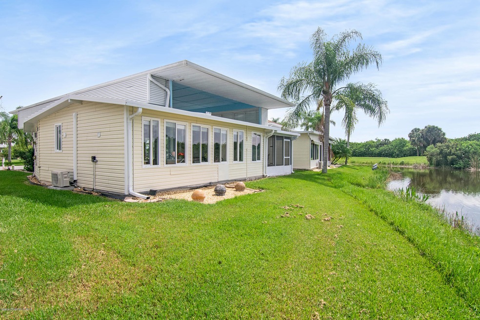 180 Coach Club Dr, Titusville, FL 32780 - photo 1