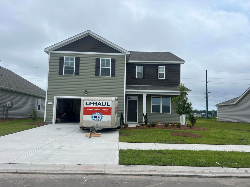 Front facade featuring a front yard