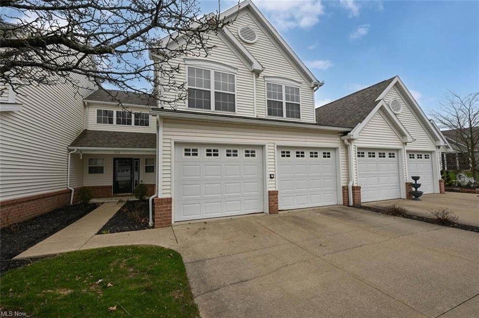 View of property with garage