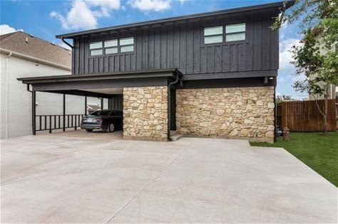 Back of property with a carport